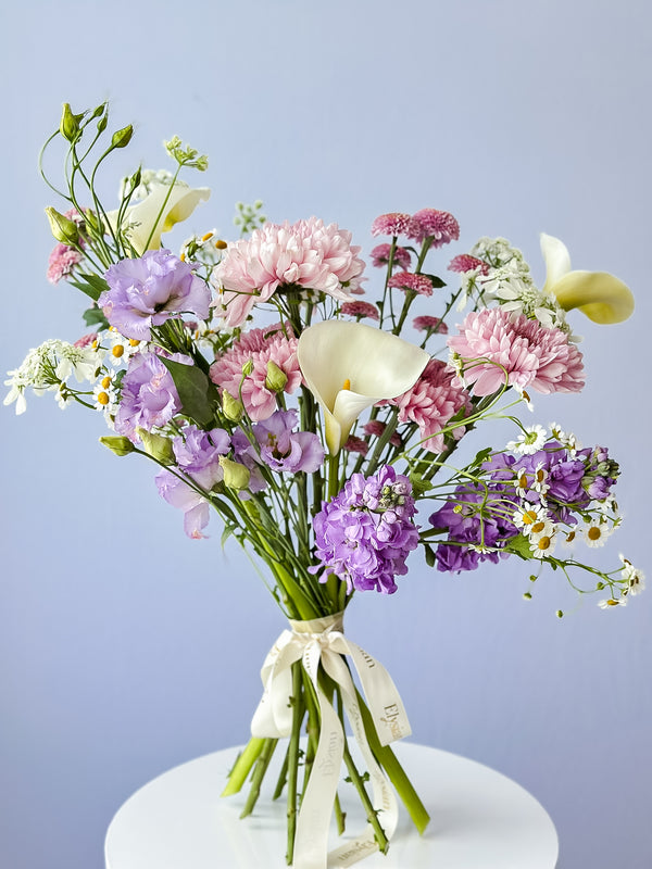 perfect mix of purple and lavander local seasonal blooms