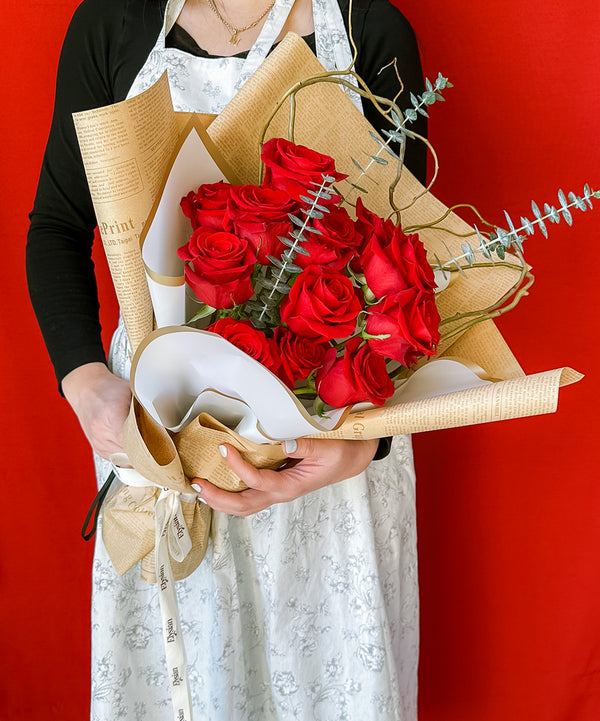 beautiful wrapped 12 freedom roses with eucalyptus and curly willow