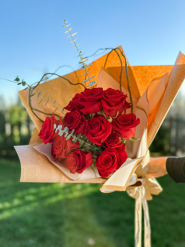 bouquet of red roses with eucalyptus